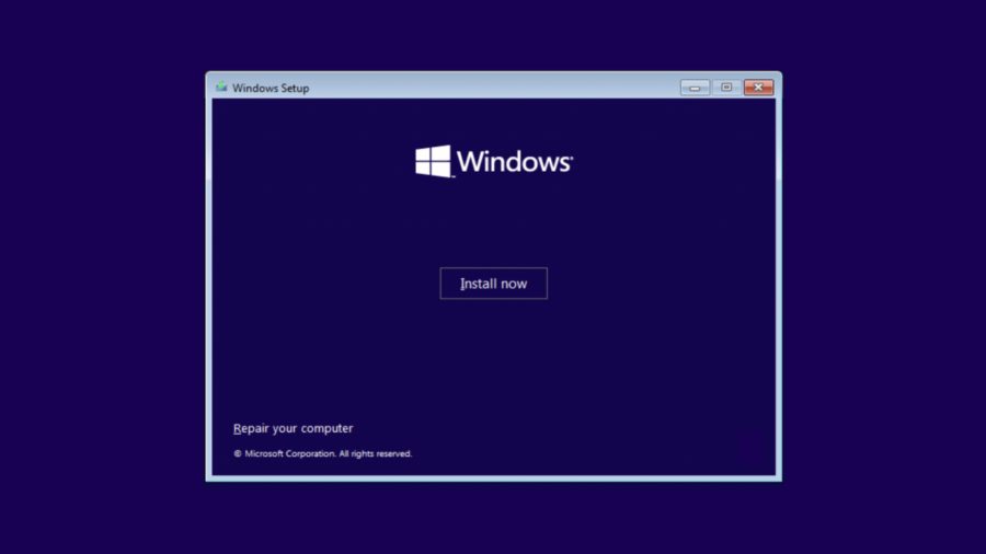 Windows 11 installation screen with install now button and navy backdrop